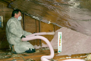 Fiberglass Insulation being used to add energy efficiency to an attic in Massillon
